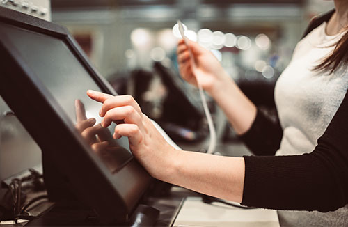 Women using a POS touchscreen system in a restaurant